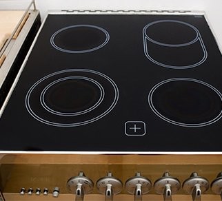 Cooker repair being carried out in a Plymouth kitchen